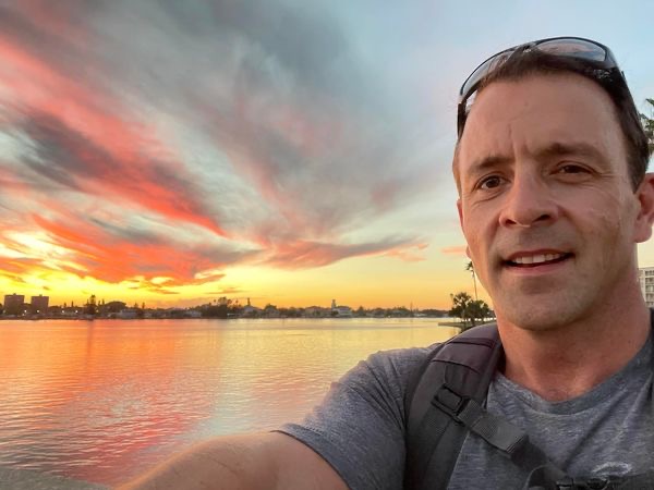 Brandon Wright at sunset over the water near St. Pete Beach